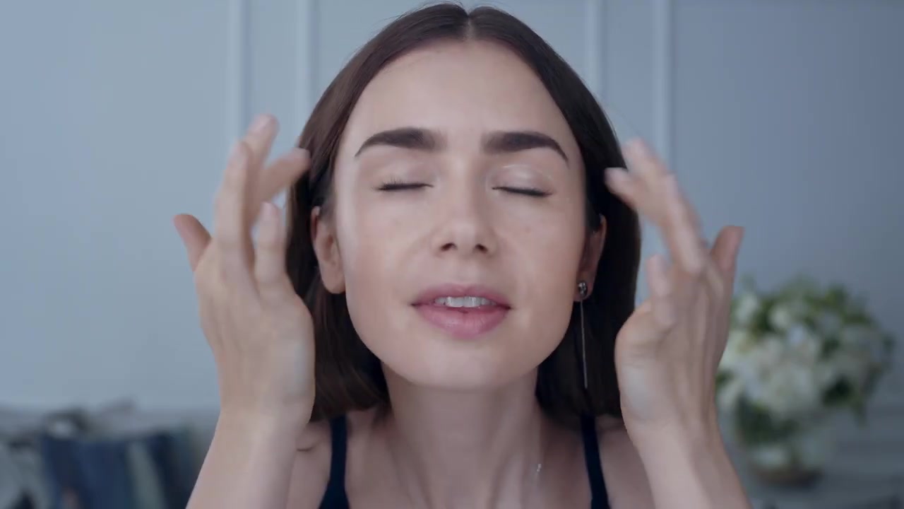 15_seconds_to_Youthful2C_Brighter_Eyes_with_Lily_Collins_-_NEW_Advanced_Genifique_Eye_Cream_048.jpg